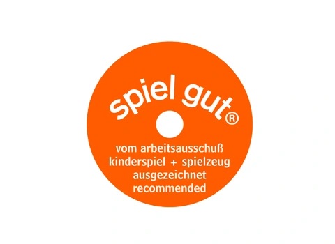 Runder, orangener Aufkleber mit dem Text „spiel gut“ und Empfehlungen für Spielzeug.